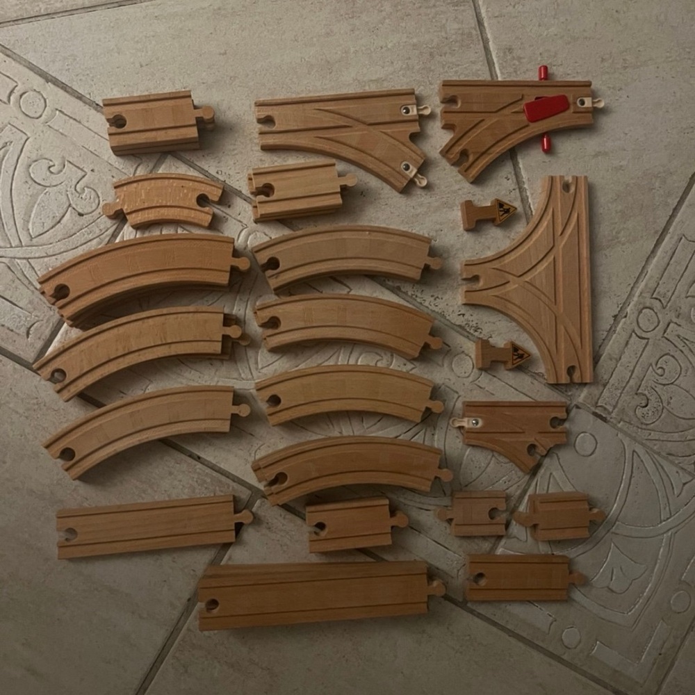 wooden railway tracks and directional pieces